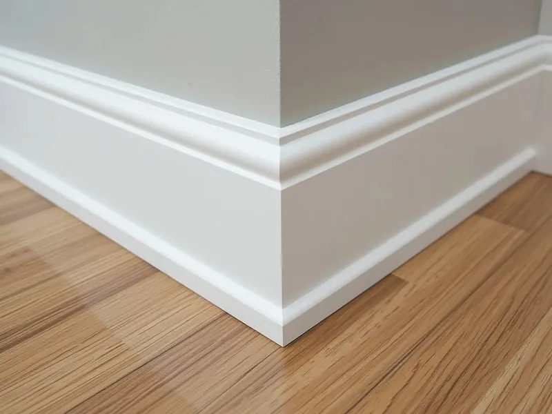 Mitred skirting detail meeting a timber floor