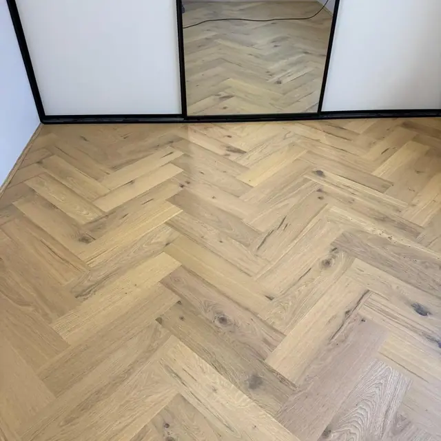 Light oak herringbone flooring in a Perth living room