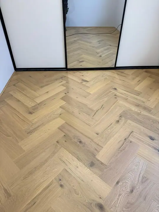 Light oak herringbone flooring in a Perth living room