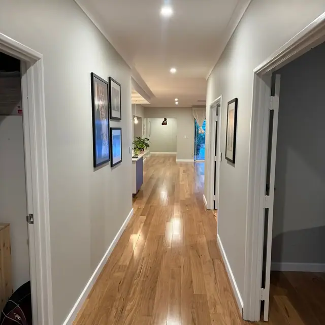 Warm timber flooring running the length of a Perth hallway