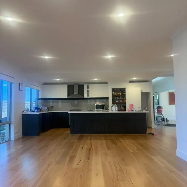 Engineered blackbutt boards running from the kitchen through to the living area