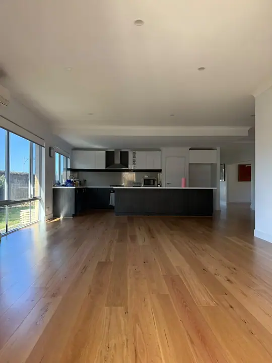 Engineered timber boards running toward the kitchen in a new Butler build