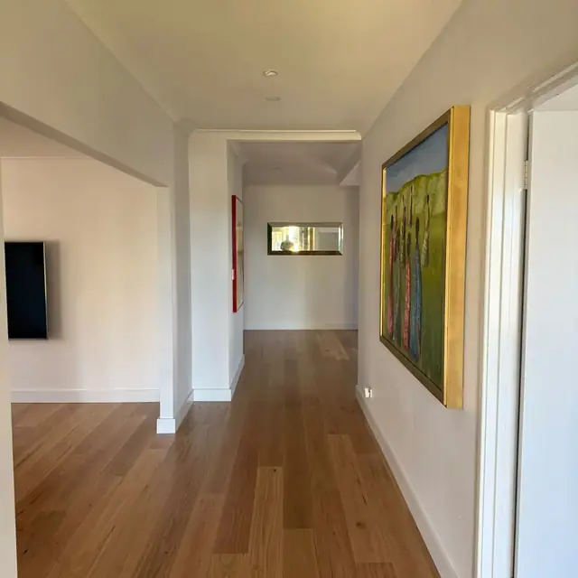 Engineered blackbutt hallway flooring beside a framed artwork in Butler