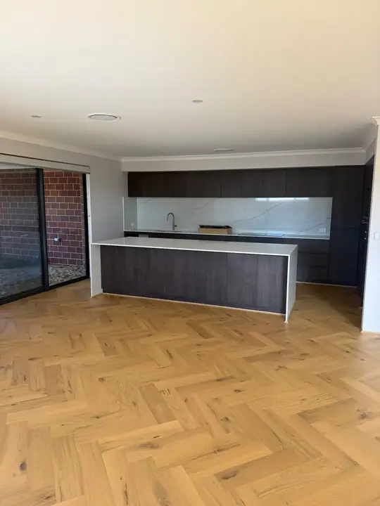 French herringbone oak flooring through a Perth kitchen and dining area