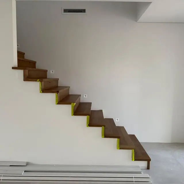 Dark timber stair treads installed on a new flight