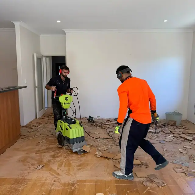 Nulook crew lifting an old floor with a stripping machine