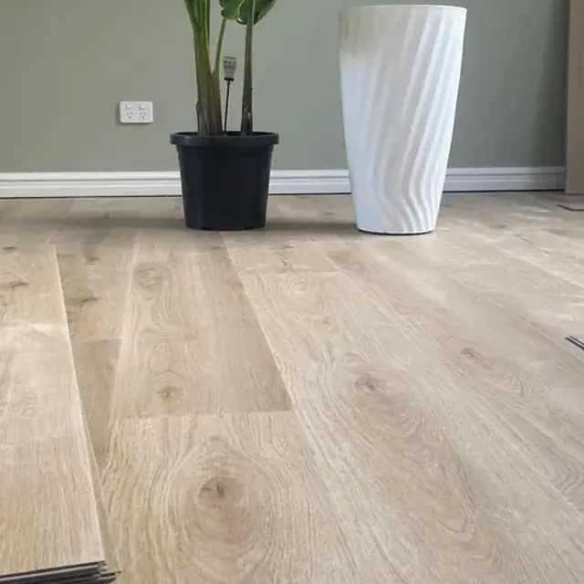 Hybrid flooring being laid in a Perth living room