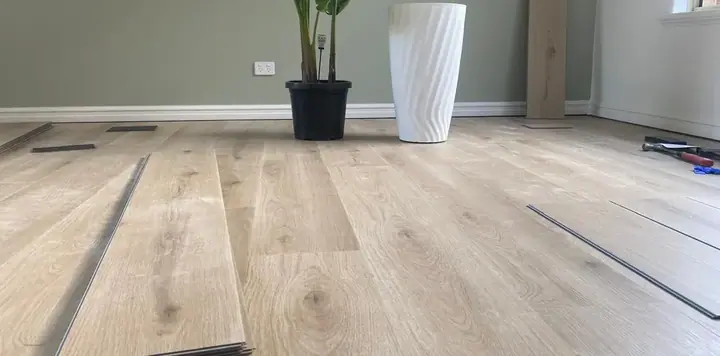 Hybrid flooring being laid in a Perth living room