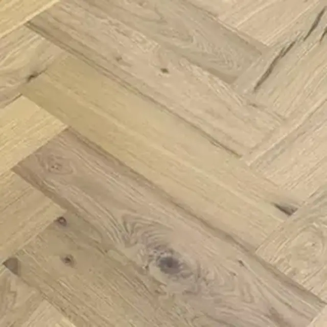 Close-up of light oak herringbone boards showing the grain